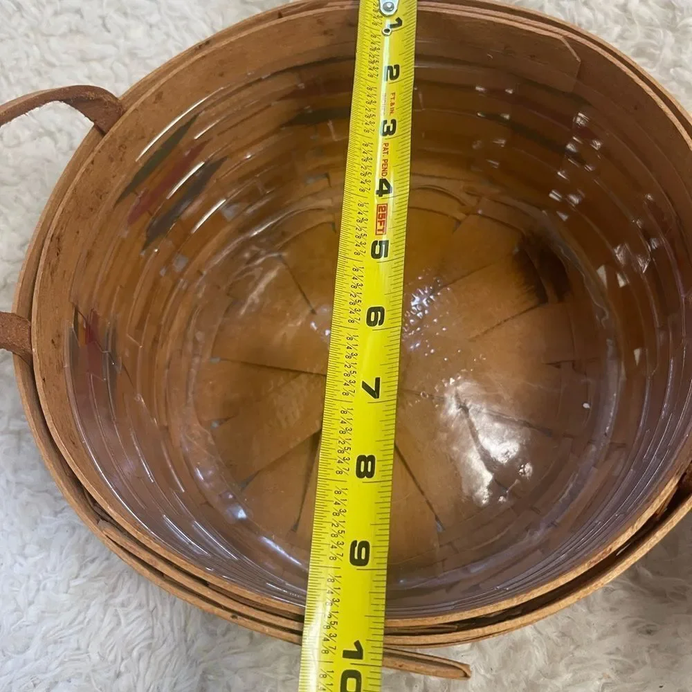 Longaberger 1995 set of two Handcrafted round and Square Woven baskets .